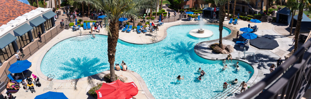 Attendees congregate around pool 1 at Alexis Park